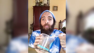 Handsome guy with a sexy beard does a smoothie bowl review