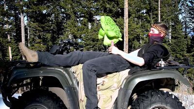 Horny man is fucking a stuffed doll in the open air