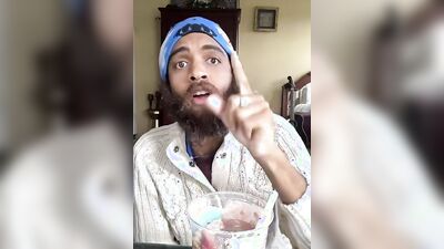 Cute bearded guy has fun doing a food bowl review