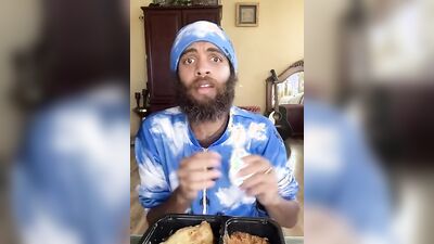 Cute Latino with a sexy beard does a food review
