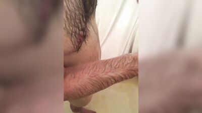 Hairy guy shows his big hard cock and jerks off