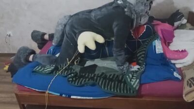 Guy in a costume is humping that stuffed doll on webcam video