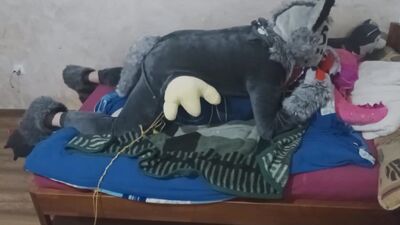 Guy in a costume is humping that stuffed doll on webcam video