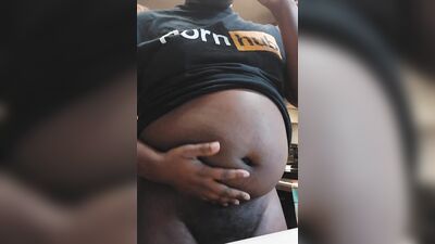 Chubby black man shows his big belly and jerks off