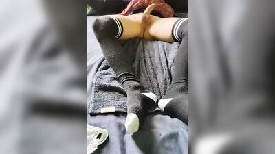 Femboy in long socks is playing with his dick and balls