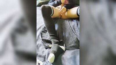 Femboy in long socks is playing with his dick and balls