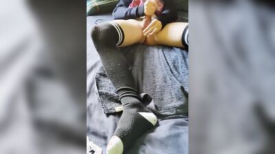 Femboy in long socks is playing with his dick and balls