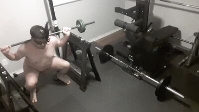 Security camera films a naked guy while he's working out