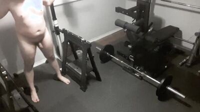 Security camera films a naked guy while he's working out