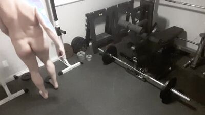 Security camera films a naked guy while he's working out