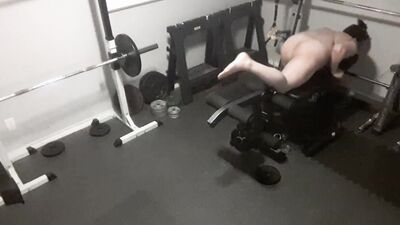 Security camera films a naked guy while he's working out