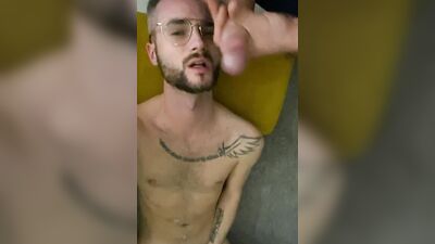 Nerdy guy is filming himself while sucking a hard pecker