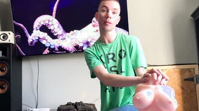 Kinky guy is reviewing different sex toys and dolls on webcam