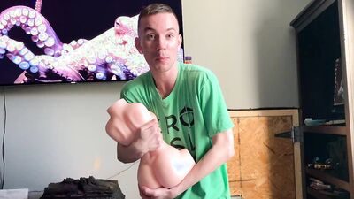 Kinky guy is reviewing different sex toys and dolls on webcam