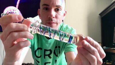 Kinky guy is reviewing different sex toys and dolls on webcam