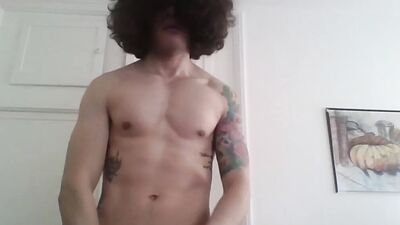 Femboy in long socks is spreading legs and playing with his ass