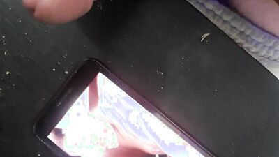 Horny guy watches gay porn on his phone and jerks off