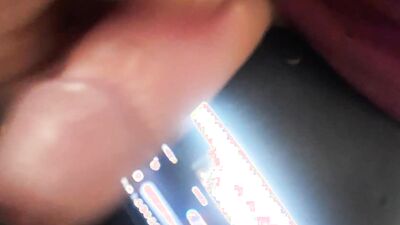 Horny guy watches gay porn on his phone and jerks off