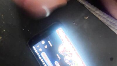 Horny guy watches gay porn on his phone and jerks off