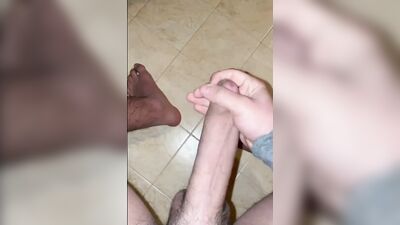 This lad has a long cock and he strokes it for the camera