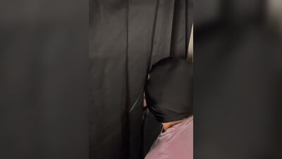 Masked gimp is passionately sucking a cock through that gloryhole