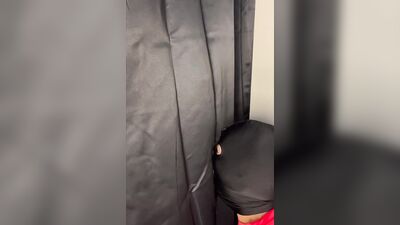 Masked gimp grabs a boner and sucks it through a gloryhole