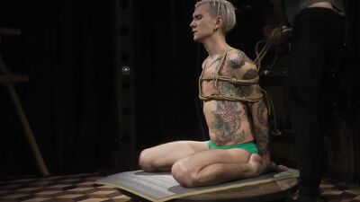Tightly bound guy is dominated and tickled by a kinky master