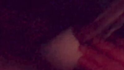 Masked gimp wraps his lips around a massive dildo and sucks it