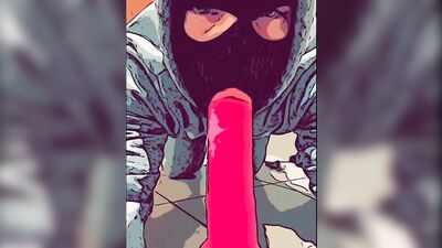 Masked gimp wraps his lips around a massive dildo and sucks it
