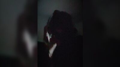 Masked gimp wraps his lips around a massive dildo and sucks it