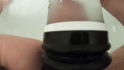 Kinky guy pushes his cock in a special toy in the bathroom
