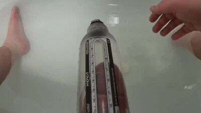 Kinky guy pushes his cock in a special toy in the bathroom