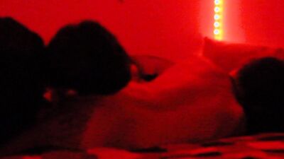 Two horny gay chums are lovemaking in the dark red room