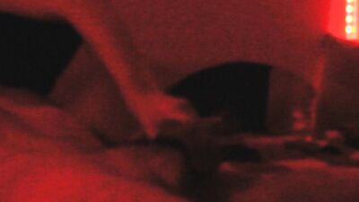 Two horny gay chums are lovemaking in the dark red room
