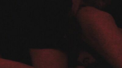 Two horny gay chums are lovemaking in the dark red room