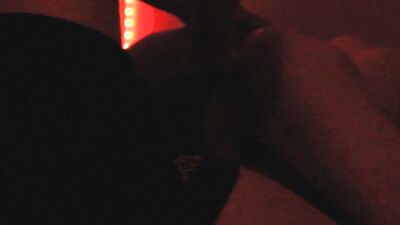 Two horny gay chums are lovemaking in the dark red room