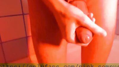 Sexy hell-boy jerking off in the shower. Cum flows over the rubber boot.
