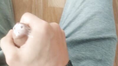 Lying on the floor, in my pajamas, I am playing again with my thick milk and this nice huge fat cock