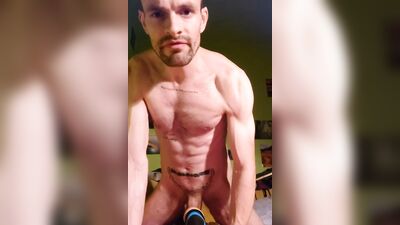 Handsome guy is posing naked in front of the phone
