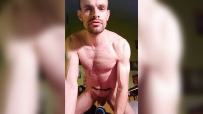 Handsome guy is posing naked in front of the phone