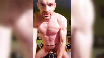 Handsome guy is posing naked in front of the phone