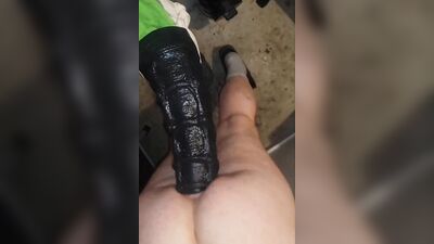 Perverted gay bloke is stretching his ass with huge black dildo