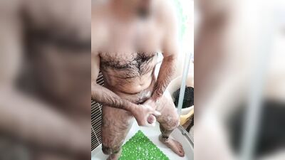 Amateur bloke is stroking his hard prick while taking a shower