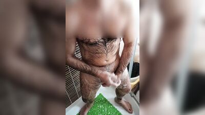 Amateur bloke is stroking his hard prick while taking a shower
