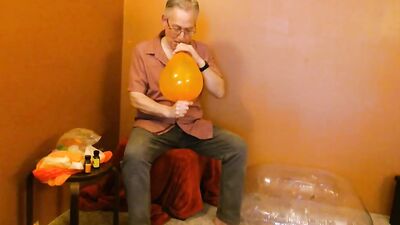Perverted grandpa is playing with a balloon in his solo video