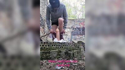 Amateur chap is rising big dildo deep inside the forest