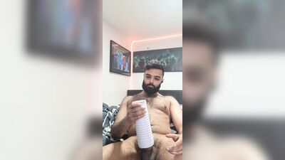 Amateur bearded bloke is shoving a cock into his favorite toy