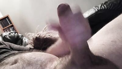 Amateur dude is stroking his prick inside the hotel room
