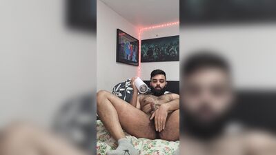 Amateur bearded bloke plays with a dick in front of the camera