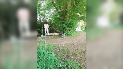 Amateur chubby bloke is playing with a prick out in the open
